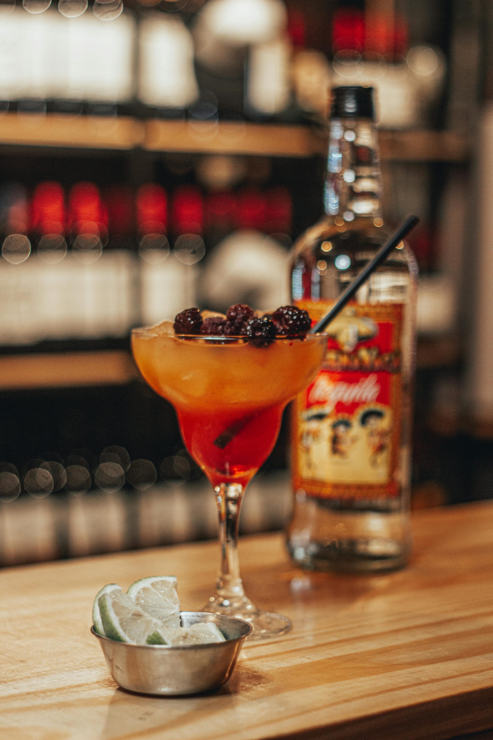 Clear Wine Glass With Orange Liquid Inside